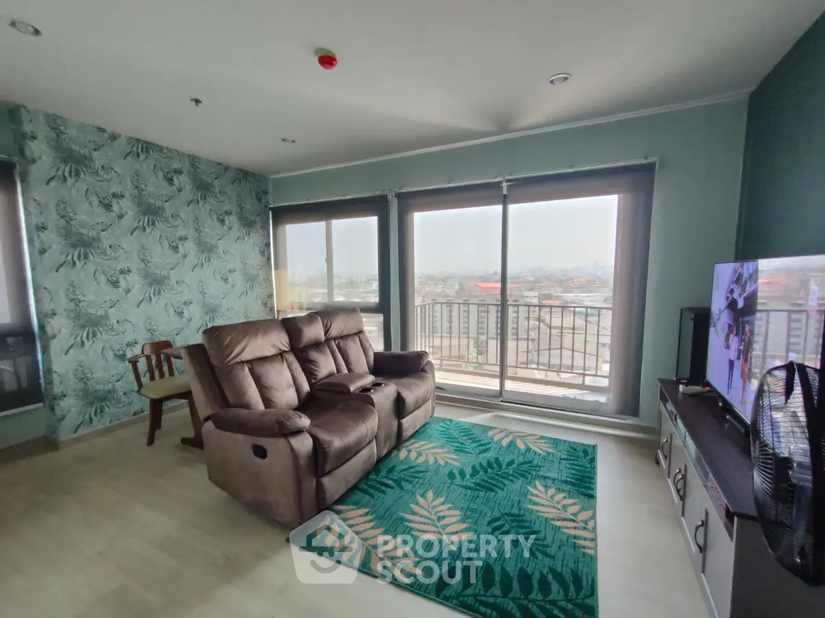 Spacious living room with panoramic city view and modern decor