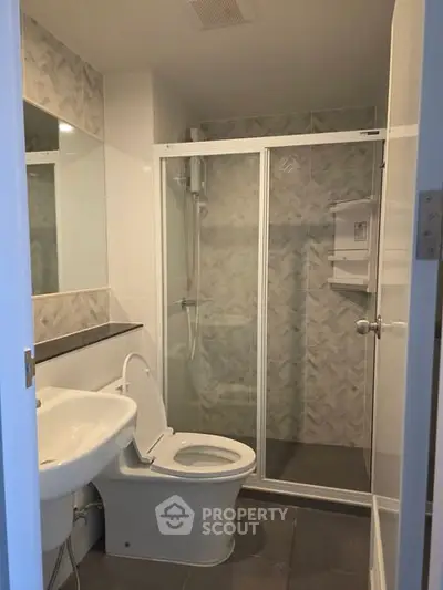 Modern bathroom with glass shower and sleek fixtures