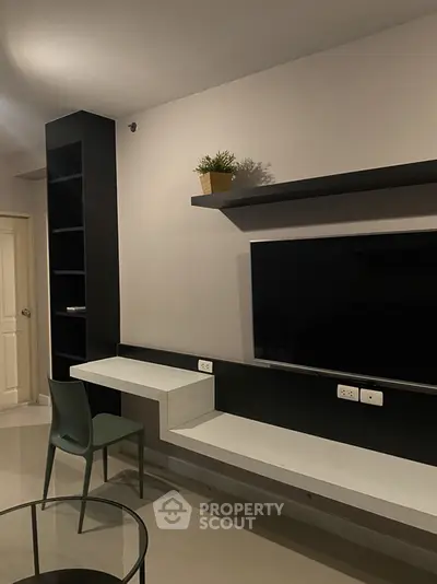 Modern living room with sleek TV setup and stylish furniture