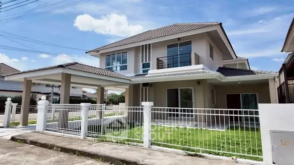 Stunning two-story house with modern design and spacious balcony in a serene neighborhood.