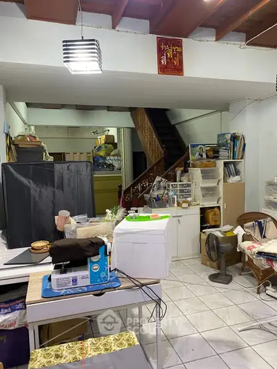 Cozy interior space with staircase and storage, ideal for creative projects.