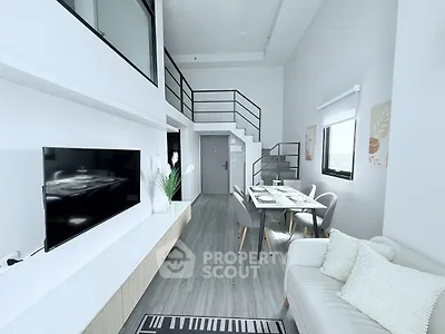 Modern living room with high ceiling and stylish decor