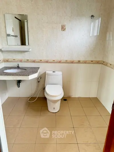 Spacious bathroom with modern fixtures and elegant tile design
