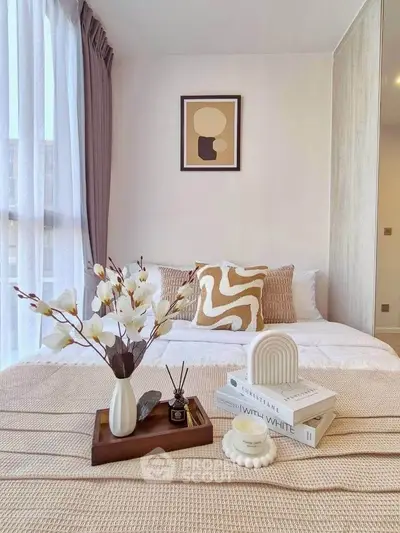 Stylish bedroom with cozy decor and modern art, perfect for relaxation.