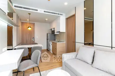 Modern apartment interior with cozy living area and compact kitchen