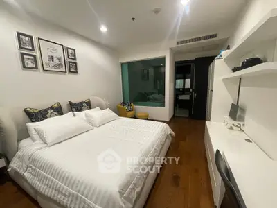 Modern bedroom with stylish decor and wooden flooring