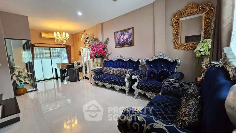 Luxurious living room with elegant furniture and chandelier lighting