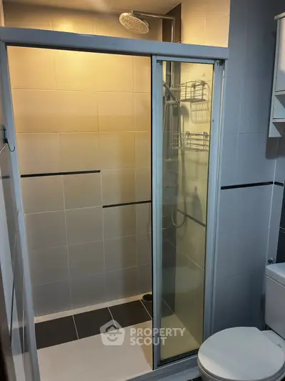 Modern bathroom with sleek shower enclosure and contemporary fixtures