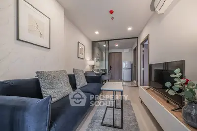 Modern living room with stylish decor and cozy seating in a contemporary apartment.