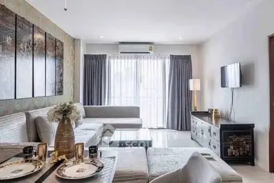 Spacious modern living room with elegant decor and ample natural light