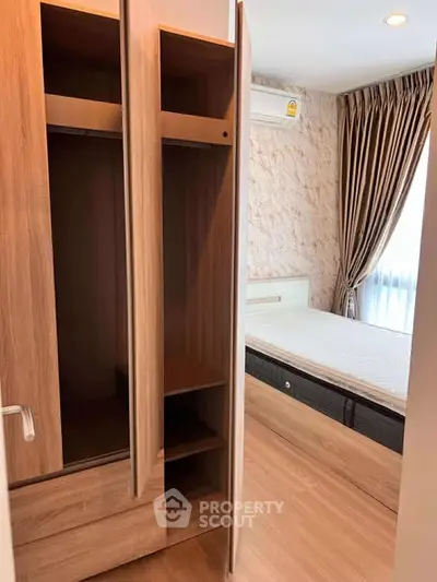 Modern bedroom with wooden wardrobe and natural light