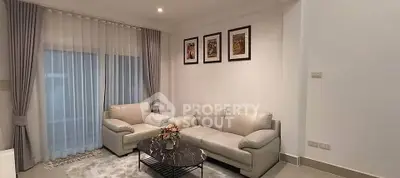 Elegant living room with modern furniture and stylish decor, perfect for relaxation and entertaining guests.