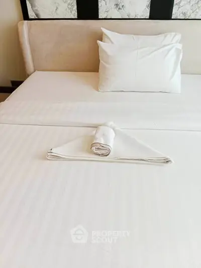 Luxurious bedroom with elegant bedding and modern decor, perfect for relaxation and comfort.