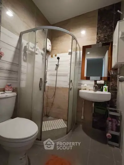 Modern bathroom with glass shower and sleek fixtures