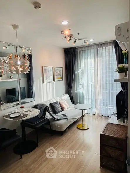 Chic modern living room with stylish decor and natural light, perfect for urban living.