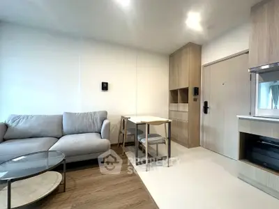 Modern living room with cozy sofa and dining area in stylish apartment