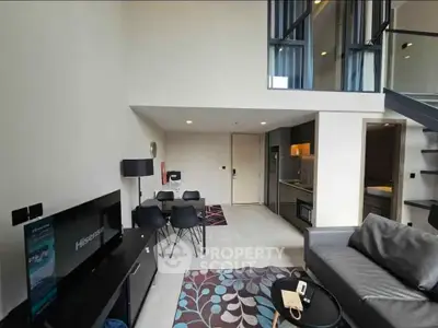 Modern loft apartment with stylish living room and open kitchen layout