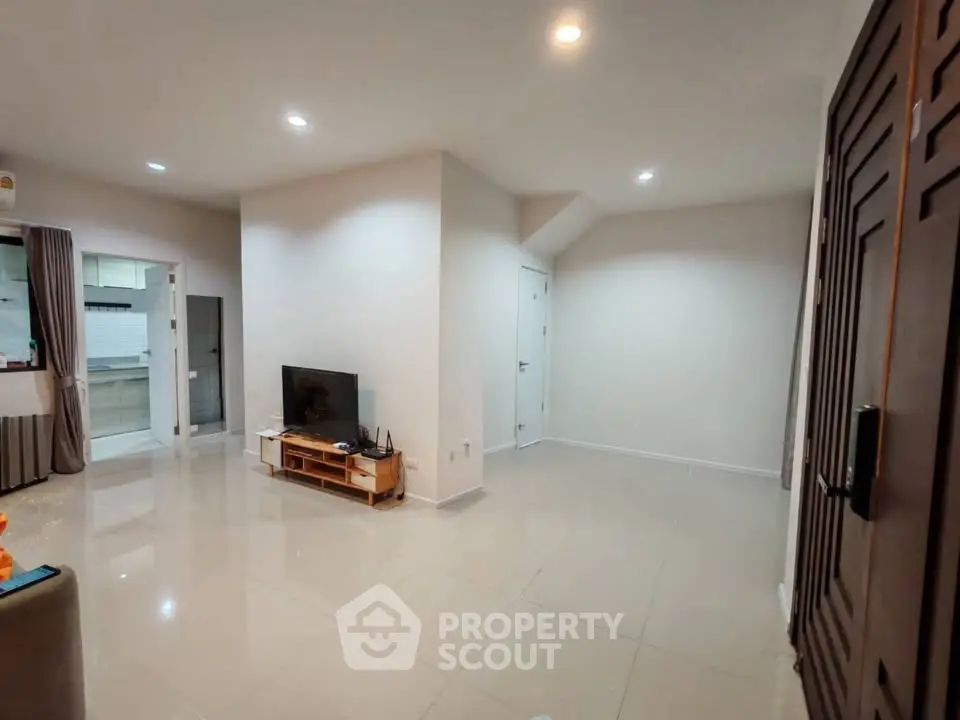 Spacious living room with modern design and ample natural light