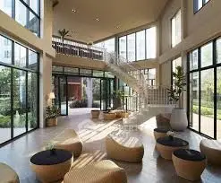 Luxurious modern living room with high ceilings and elegant spiral staircase