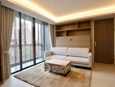 Modern living room with large windows and elegant furniture in a stylish apartment.