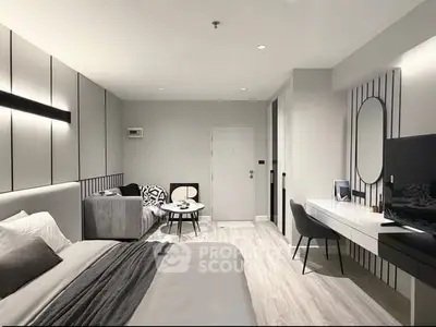 Modern bedroom with sleek design, featuring a cozy bed, stylish furniture, and elegant decor.