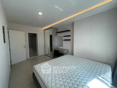 Spacious bedroom with modern design and ample natural light
