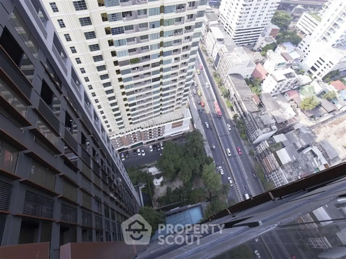 Stunning high-rise building view overlooking bustling city streets and urban landscape.