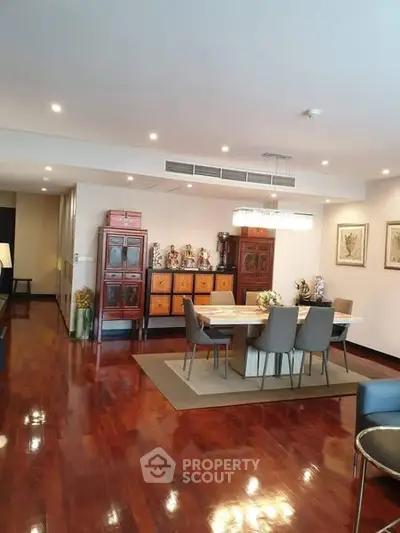Elegant dining area with polished wooden floors and modern decor