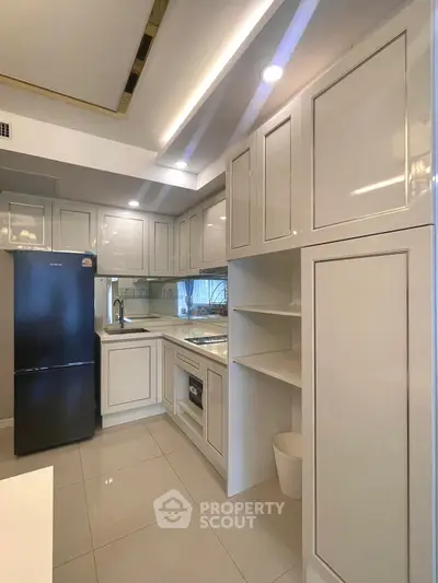 Modern kitchen with sleek cabinetry and built-in appliances