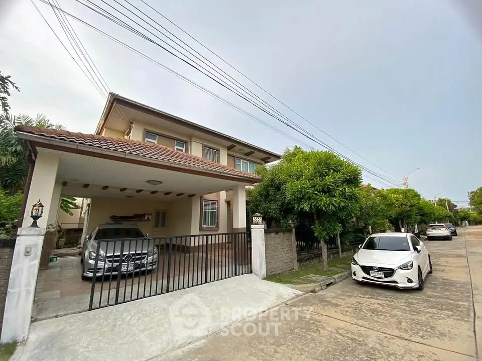 Charming suburban home with spacious driveway and lush greenery