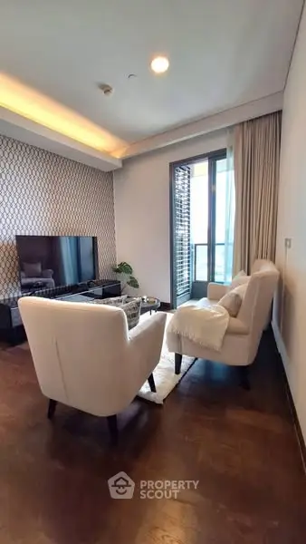Stylish living room with modern decor and balcony view