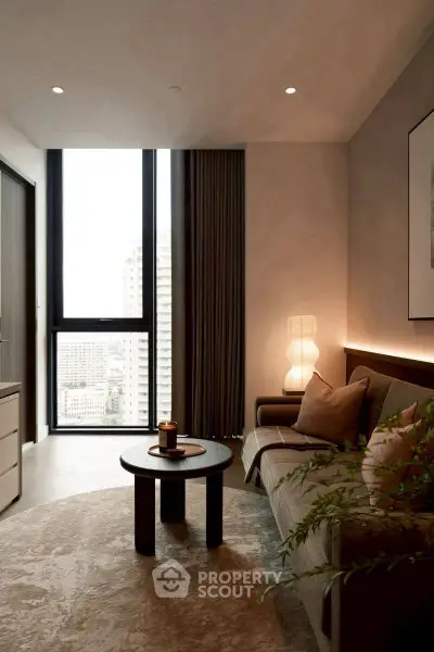 Modern living room with floor-to-ceiling windows and stylish decor in a high-rise apartment.