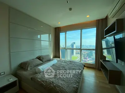 Spacious bedroom with stunning city view and modern decor