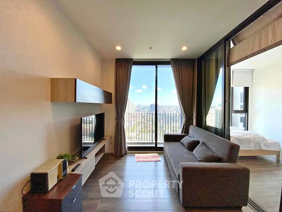 Modern living room with balcony view in high-rise apartment