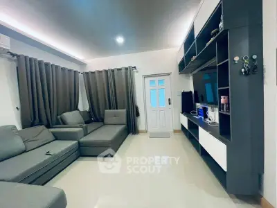 Modern living room with sleek furniture and stylish shelving unit
