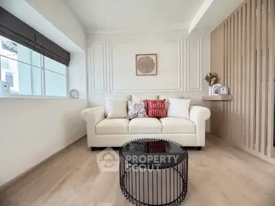 Cozy living room with modern decor and comfortable sofa