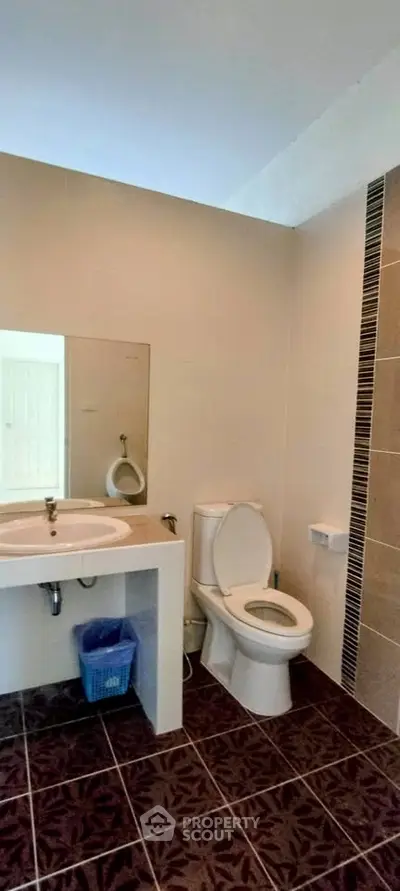 Modern bathroom with sleek design and tiled flooring