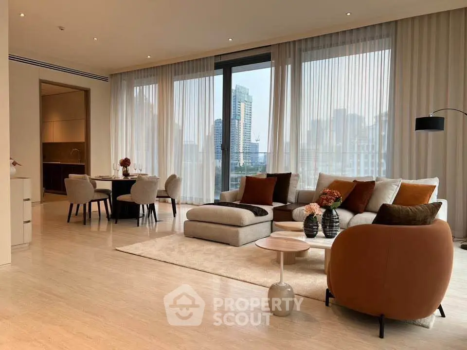 Luxurious modern living room with city view, elegant furniture, and stylish decor in a high-rise apartment.