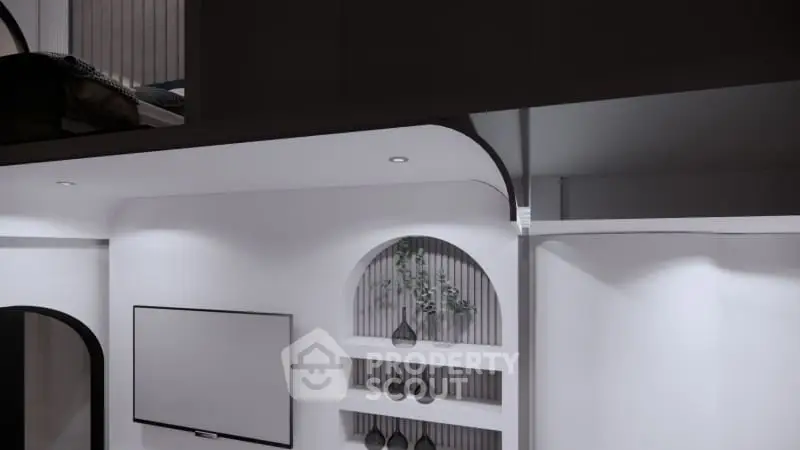 Modern living room with sleek design and built-in shelves, featuring a wall-mounted TV and stylish decor.