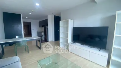 Modern living room with sleek furniture and open kitchen layout