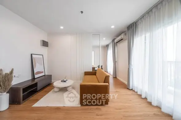 Spacious modern living room with elegant decor and natural light