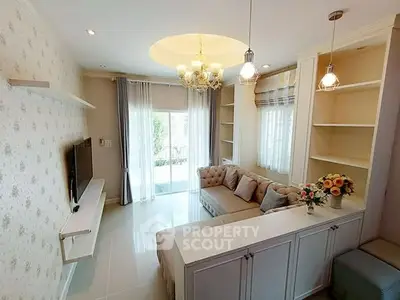 Elegant living room with modern chandelier and cozy sectional sofa