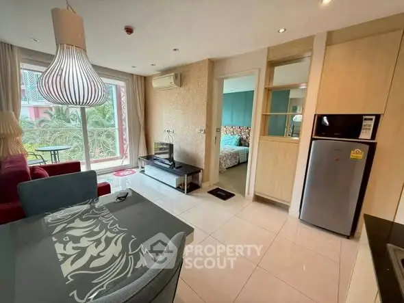 Modern open-plan living room with stylish decor and natural light