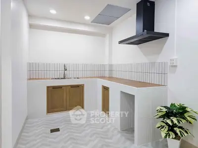 Modern minimalist kitchen with sleek design and wooden cabinetry