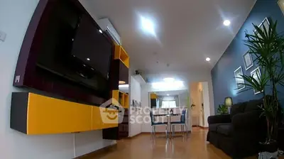 Modern living room with vibrant decor and open layout, featuring a wall-mounted TV and stylish furniture.