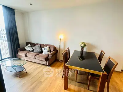 Modern living room with stylish furniture and city view, perfect for urban living.