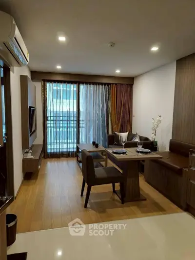 Modern living room with elegant dining area and balcony view