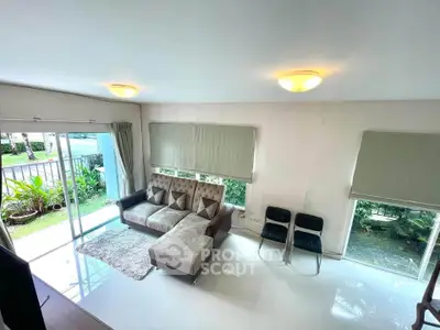 Spacious living room with modern furniture and garden view