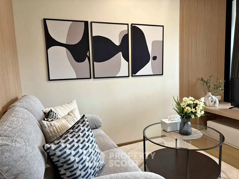 Modern living room with abstract art and cozy decor