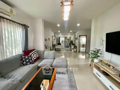 Spacious modern living room with stylish decor and natural light